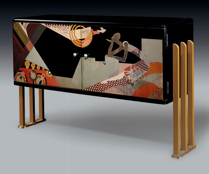 JEAN DUNAND (1887-1942)<br />
A RADIO CABINET, CIRCA 1930<br />
lacquered wood, with gilt-metal legs